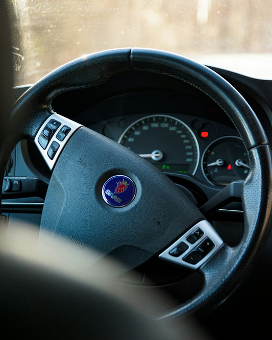 black and gray car steering wheel