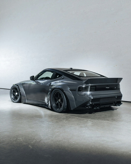 A gray sports car poses elegantly.