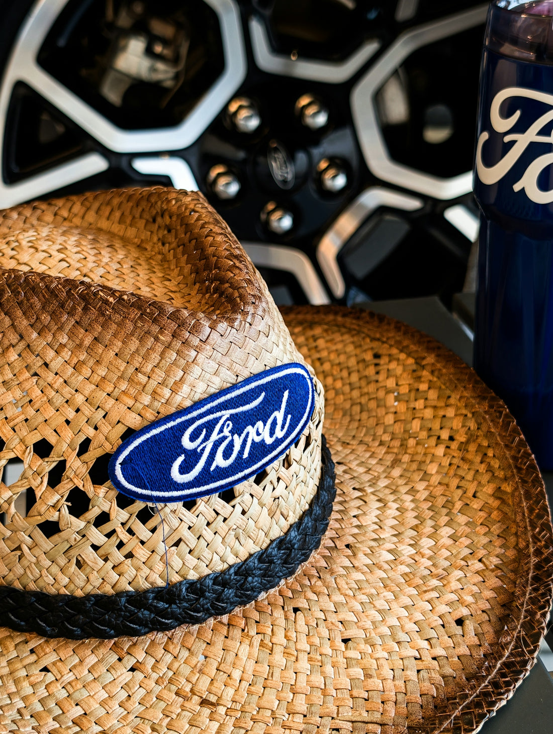 Straw hat with ford logo and car wheel