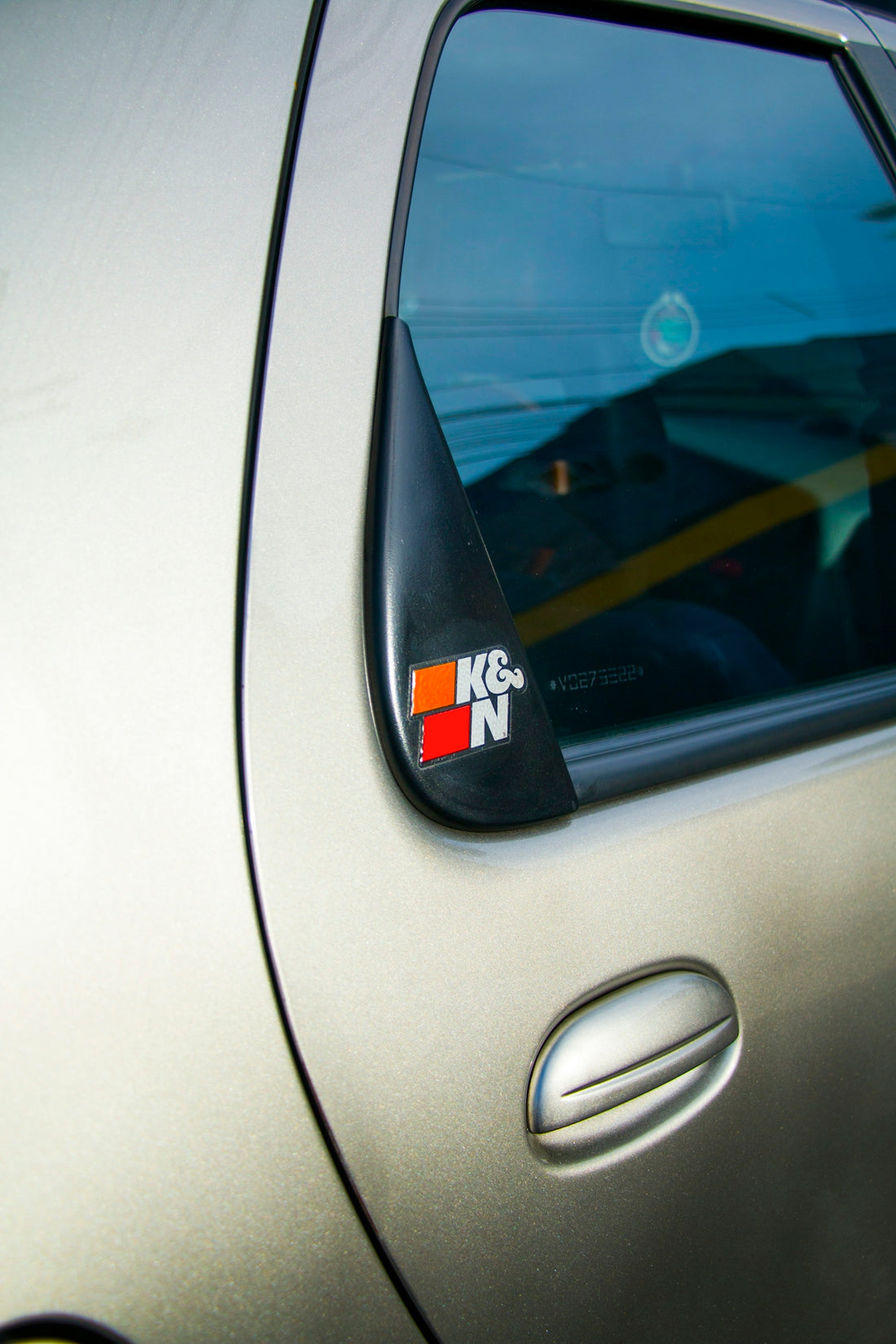 Close-up of a car door with a k&n sticker