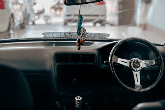 Interior view of a car dashboard and steering wheel